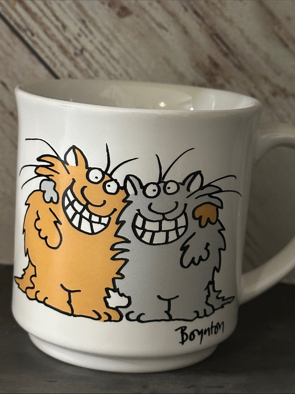 Sandra Boynton Cup, cats hugging, titled "Keep Smiling".